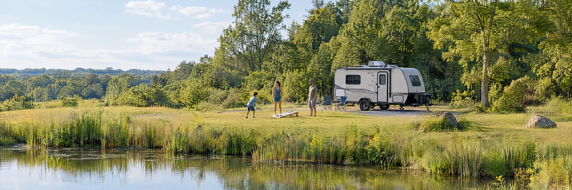 Illustration of campers enjoying family campsite activities beside a compact travel trailer in a fictional camping setting inspired by Greenport, NY.