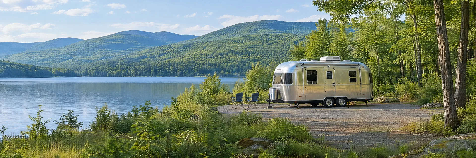 Illustration of a rounded silver travel trailer at a fictional camping setting inspired by Harris, NY.