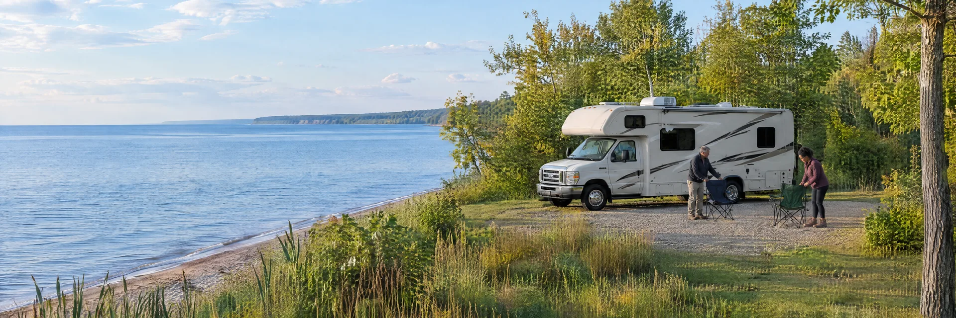 Illustration of campers enjoying setting up camp beside a Class C motorhome in a fictional camping setting inspired by Sandy Creek, NY.