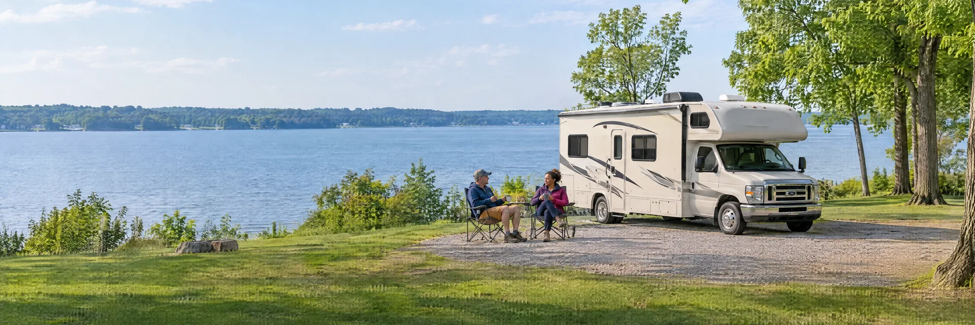 Illustration of campers enjoying morning coffee beside a Class C motorhome in a fictional camping setting inspired by Buckeye Lake, OH.