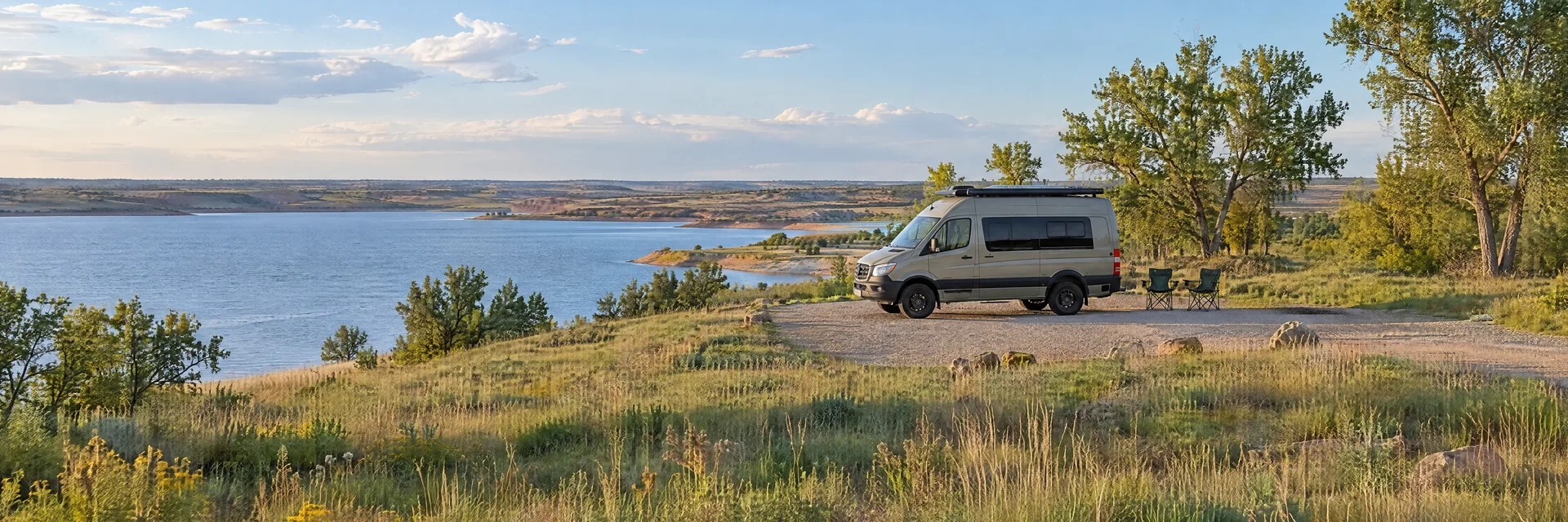 Illustration of a camper van at a fictional camping setting inspired by Canton, OK.
