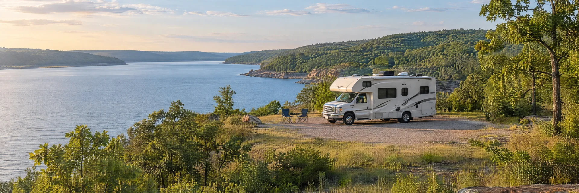 Illustration of a Class C motorhome at a fictional camping setting inspired by Sand Springs, OK.