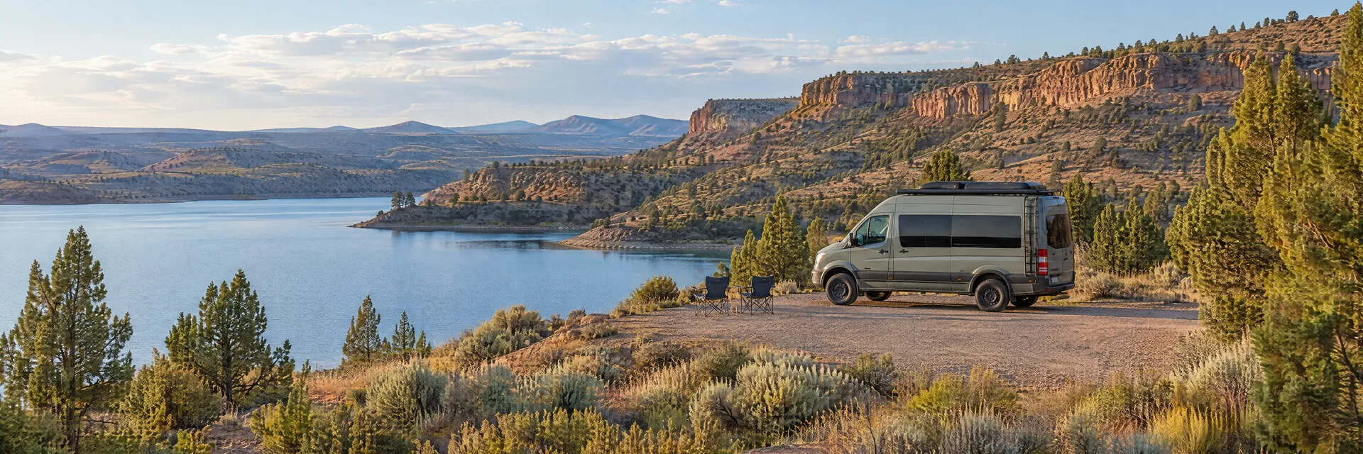 Illustration of a camper van at a fictional camping setting inspired by PRINEVILLE, OR.