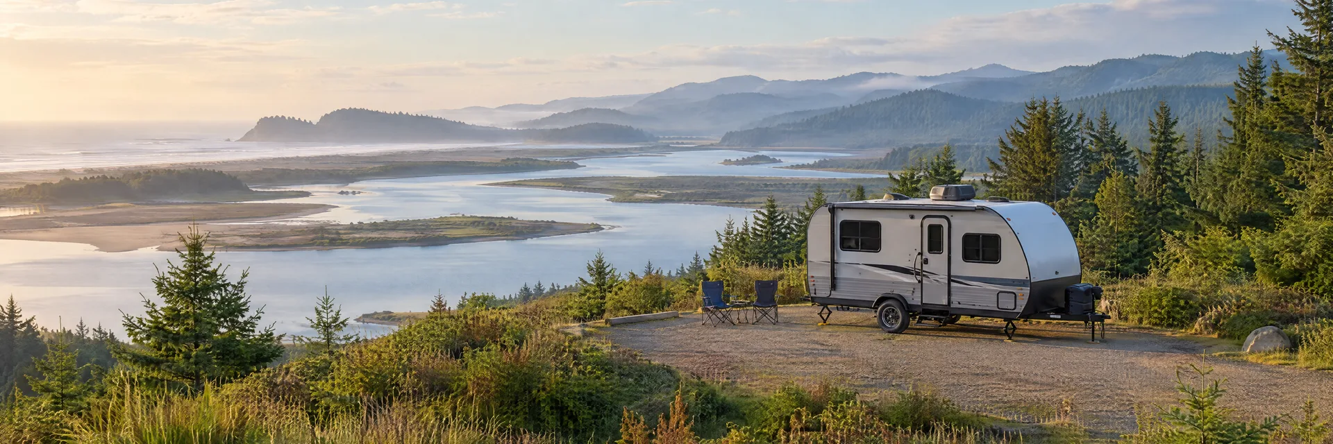 Illustration of a compact travel trailer at a fictional camping setting inspired by Reedsport, OR.