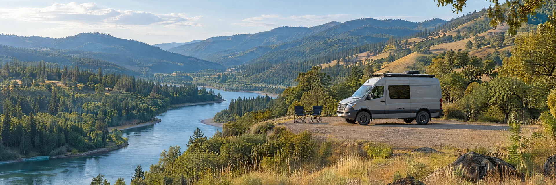 Illustration of a camper van at a fictional camping setting inspired by Roseburg, OR.