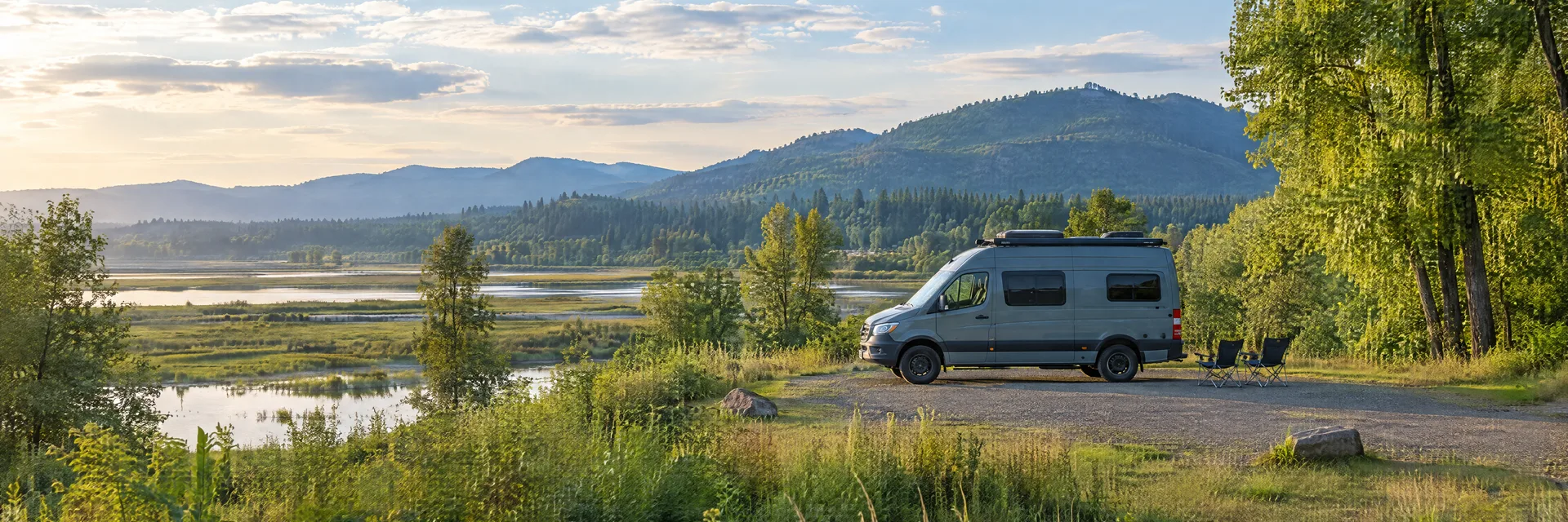 Illustration of a camper van at a fictional camping setting inspired by Scappoose, OR.