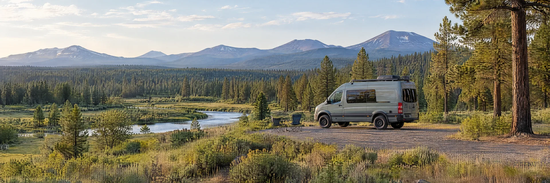 Illustration of a camper van at a fictional camping setting inspired by Sunriver, OR.