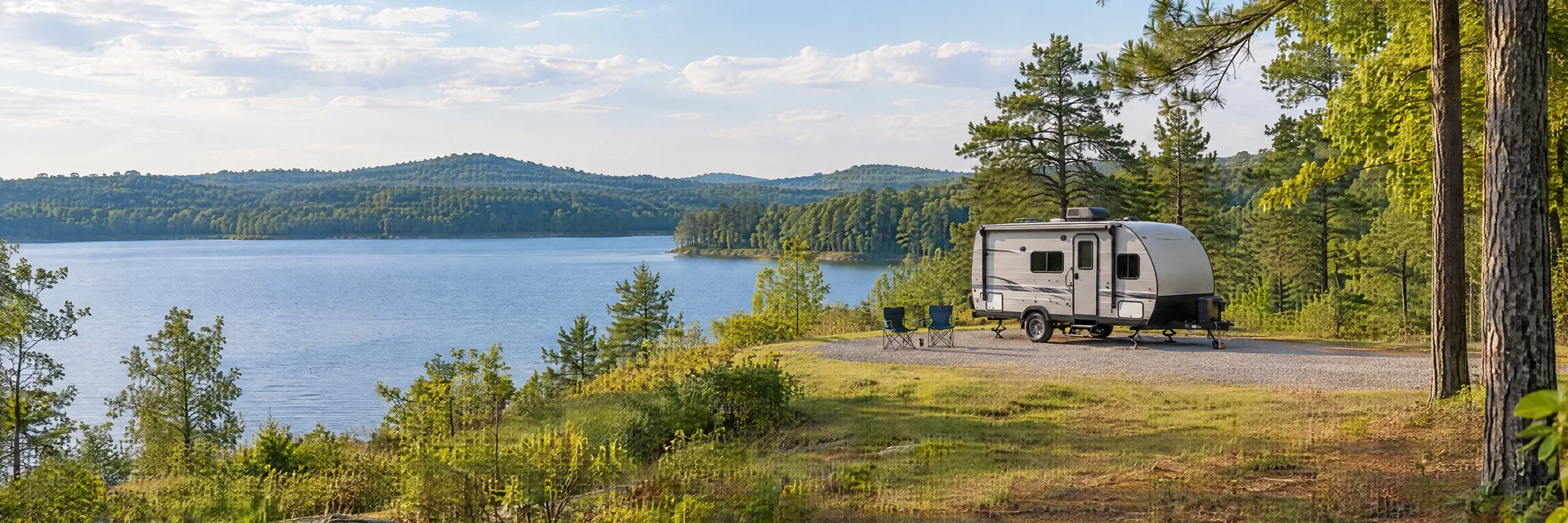 Illustration of a compact travel trailer at a fictional camping setting inspired by Columbia, SC.