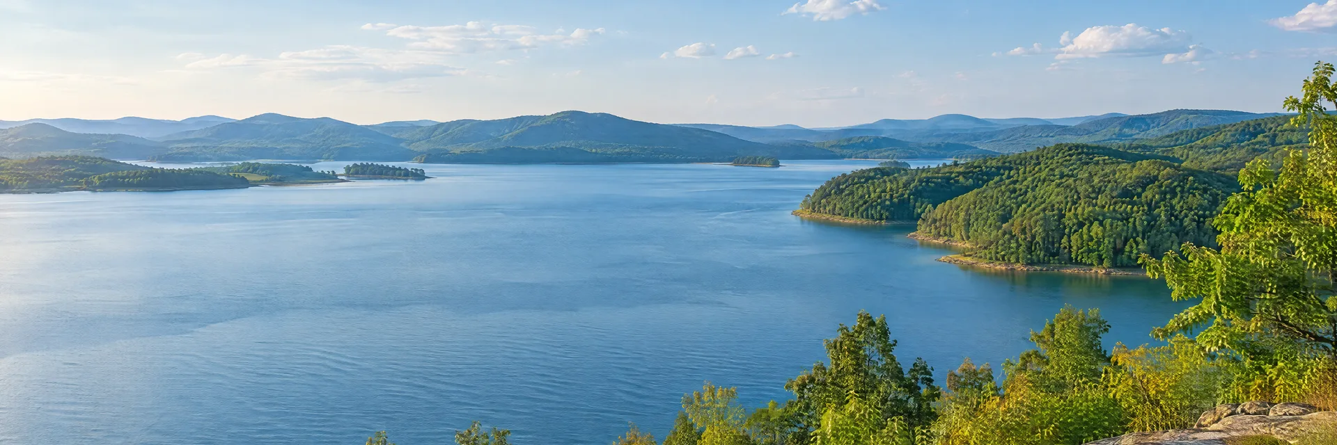Illustration inspired by Ten Mile, TN: eastern Tennessee river reservoir country, broad blue water, low wooded shores and softly rolling green hills.
