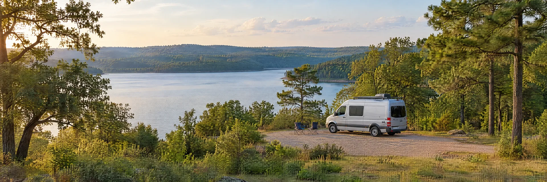 Illustration of a camper van at a fictional camping setting inspired by Athens, TX.