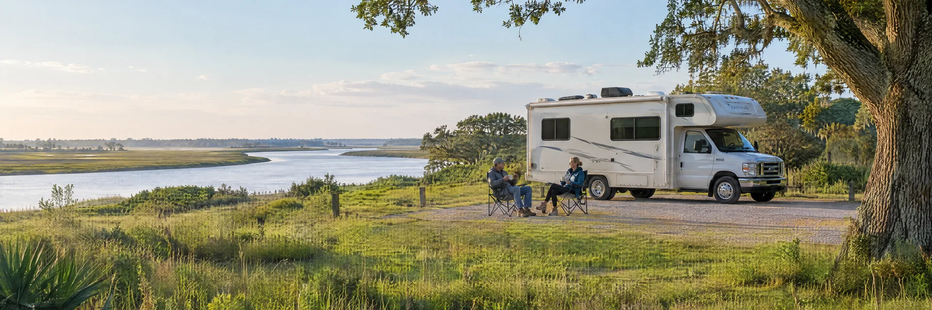 Illustration of campers enjoying morning coffee beside a Class C motorhome in a fictional camping setting inspired by Brazoria, TX.
