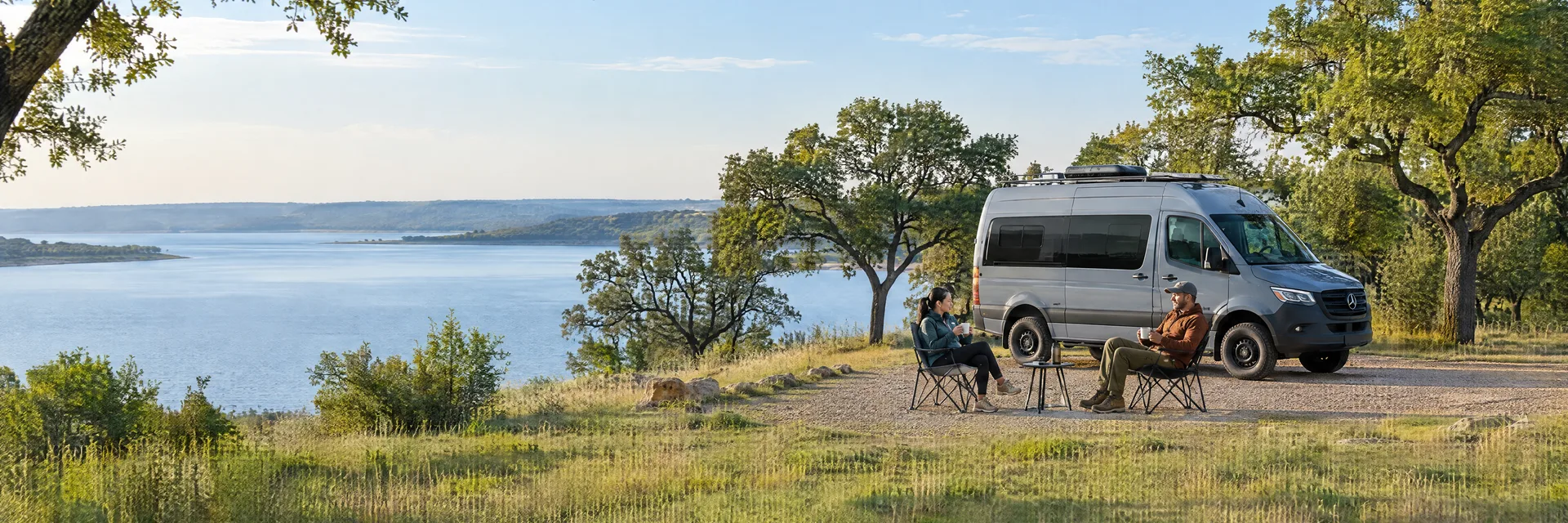 Illustration of campers enjoying morning coffee beside a camper van in a fictional camping setting inspired by Grapevine, TX.