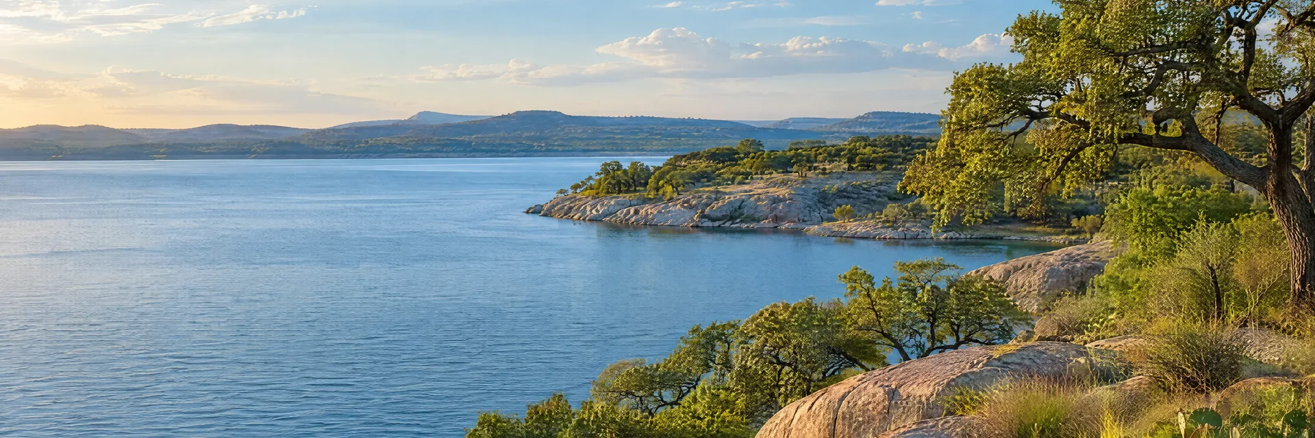 Illustration inspired by Kingsland, TX: texas Highland Lakes scenery with granite outcrops, live oaks and calm blue water.