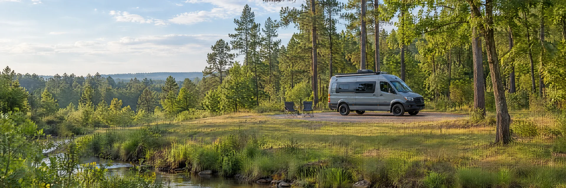 Illustration of a camper van at a fictional camping setting inspired by Lufkin, TX.
