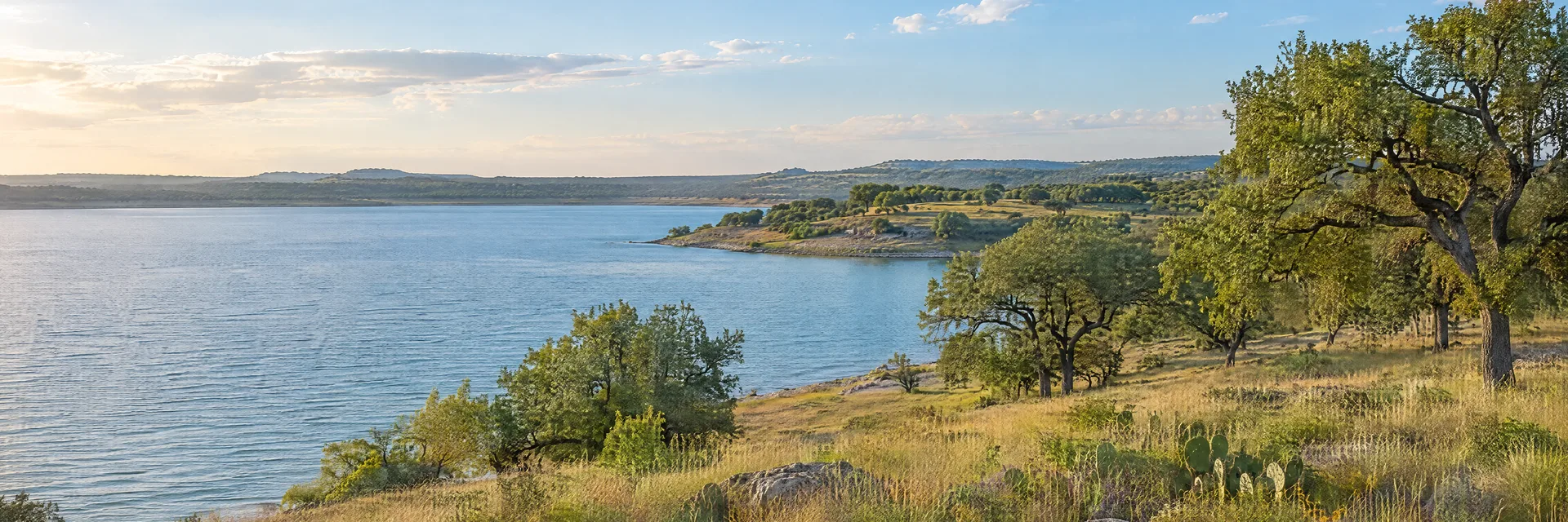 Illustration inspired by MOODY, TX: central Texas prairie lake shore, scattered oaks and gently rolling grassland.