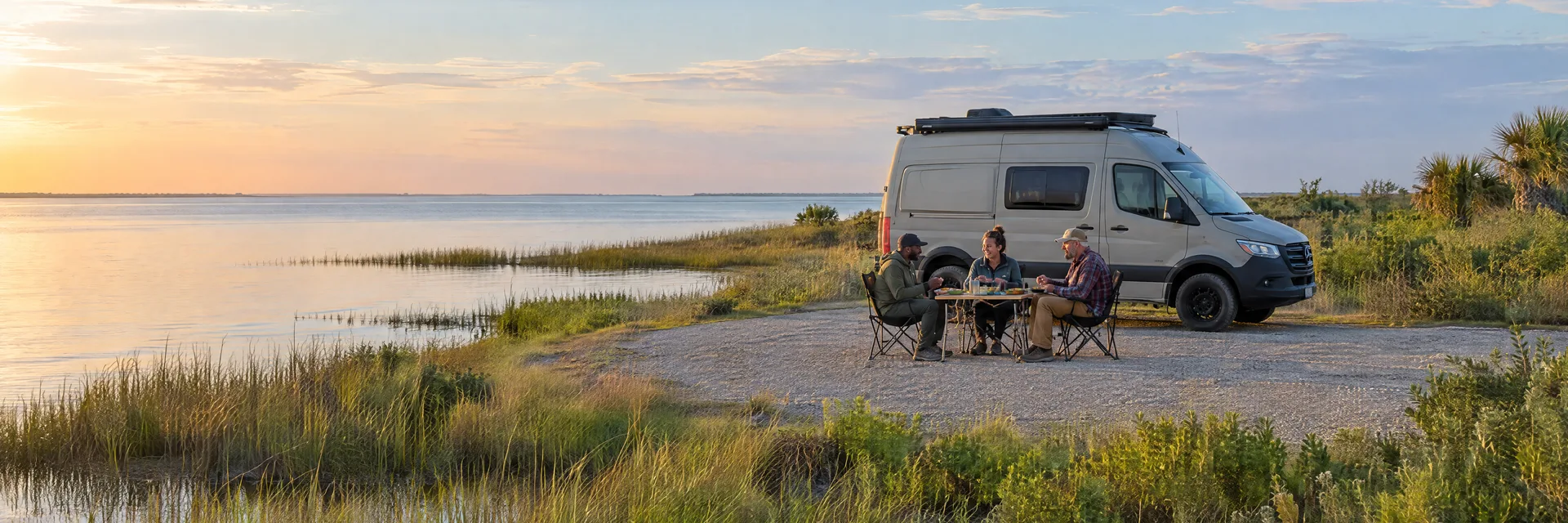 Illustration of campers enjoying an outdoor meal beside a camper van in a fictional camping setting inspired by San Leon, TX.