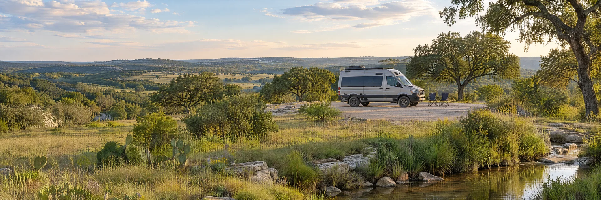 Illustration of a camper van at a fictional camping setting inspired by Schertz, TX.