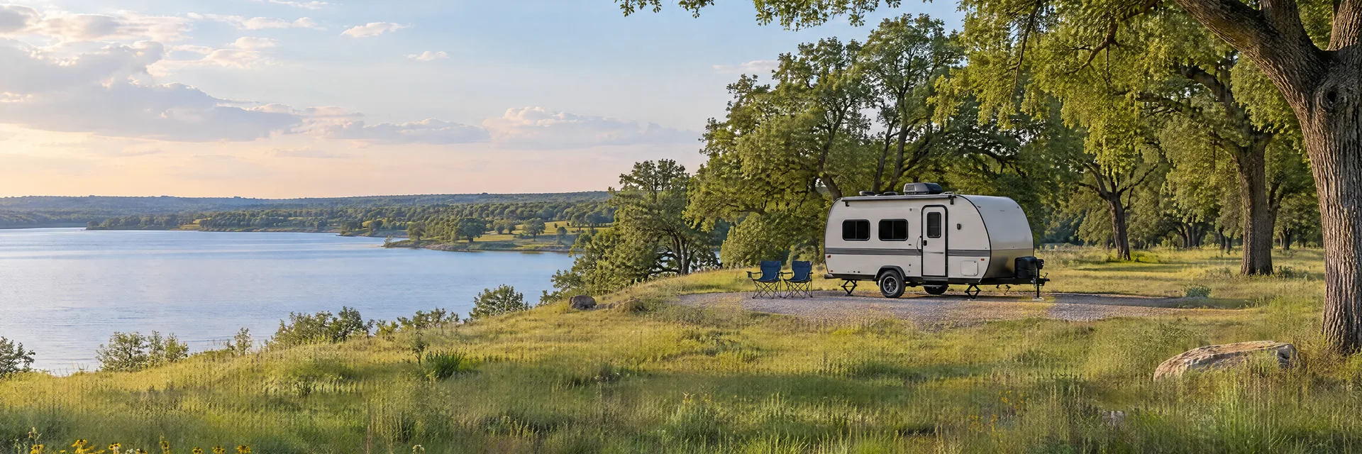 Illustration of a compact travel trailer at a fictional camping setting inspired by Sulphur Springs, TX.