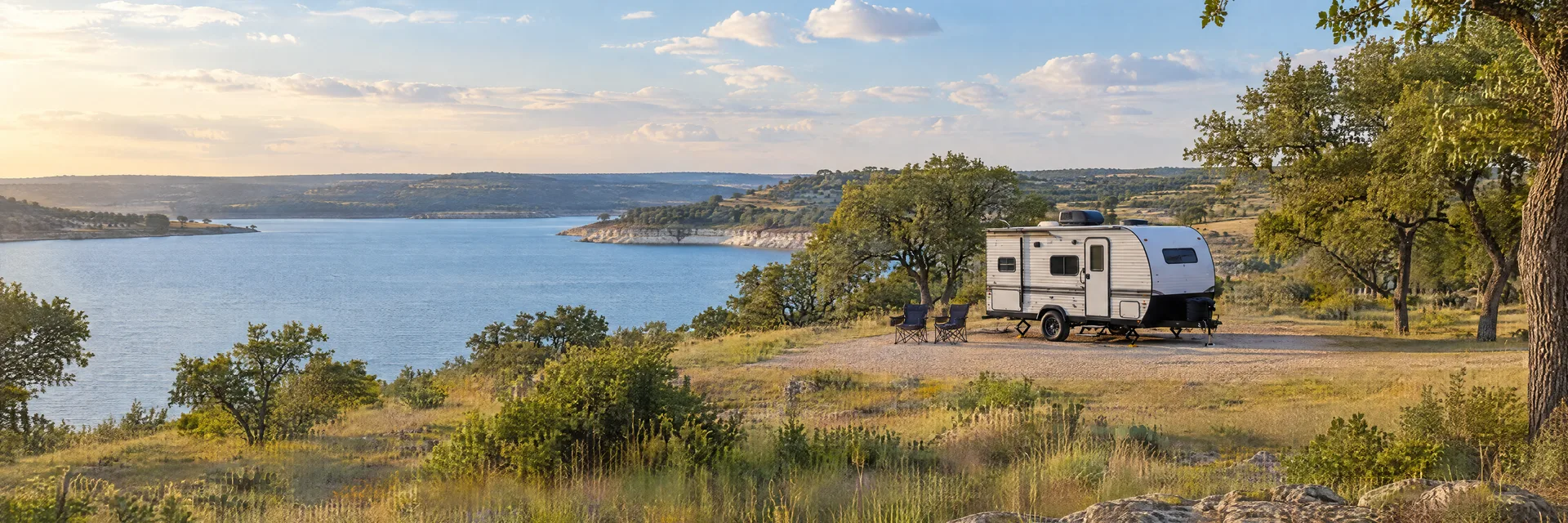 Illustration of a compact travel trailer at a fictional camping setting inspired by Temple, TX.