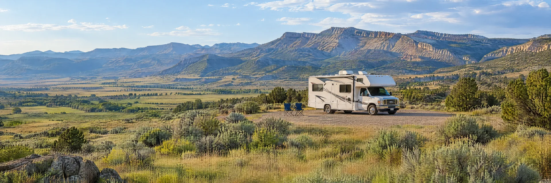Illustration of a Class C motorhome at a fictional camping setting inspired by Richfield, UT.