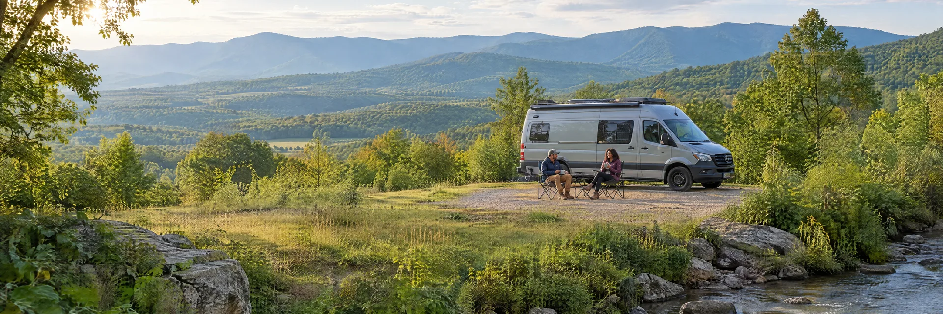 Illustration of campers enjoying morning coffee beside a camper van in a fictional camping setting inspired by Natural Bridge, VA.