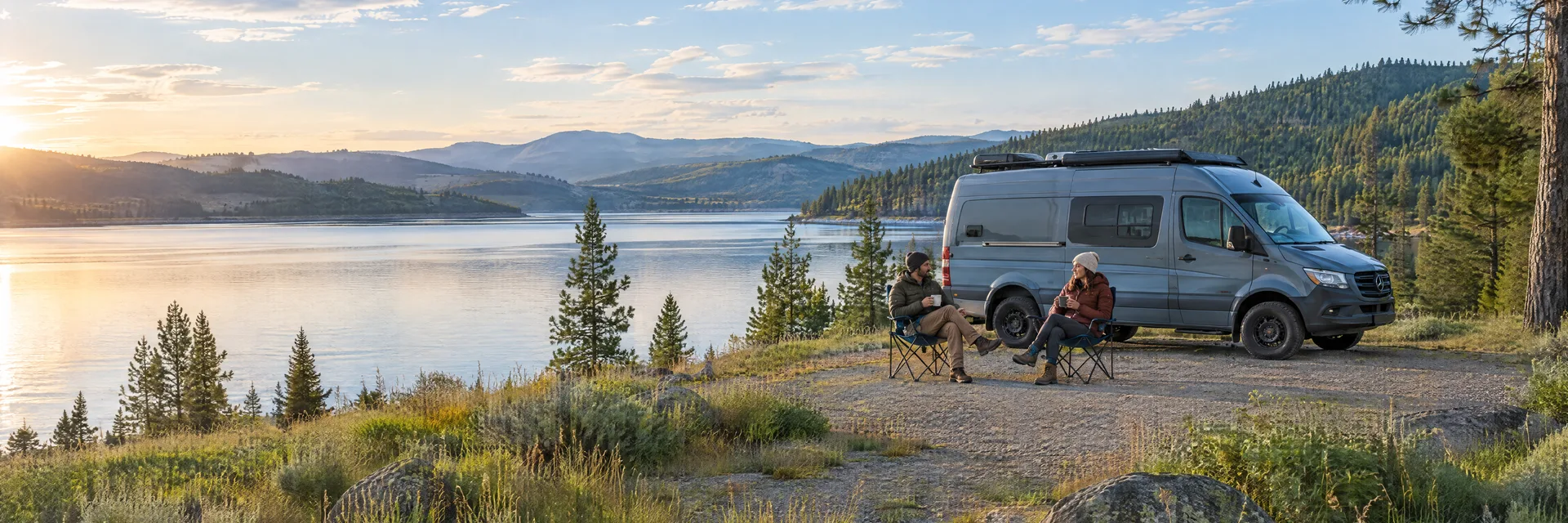 Illustration of campers enjoying morning coffee beside a camper van in a fictional camping setting inspired by Liberty Lake, WA.