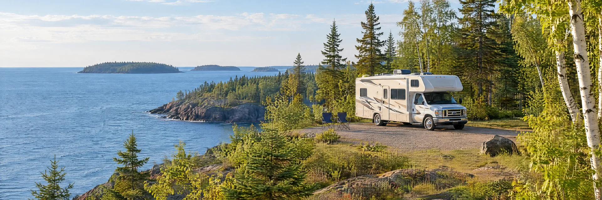 Illustration of a Class C motorhome at a fictional camping setting inspired by Bayfield, WI.