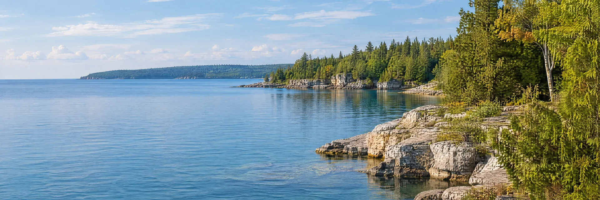 Illustration inspired by Egg Harbor, WI: wisconsin Door Peninsula, calm blue bay, pale rocky shoreline and mixed cedar and hardwood trees.