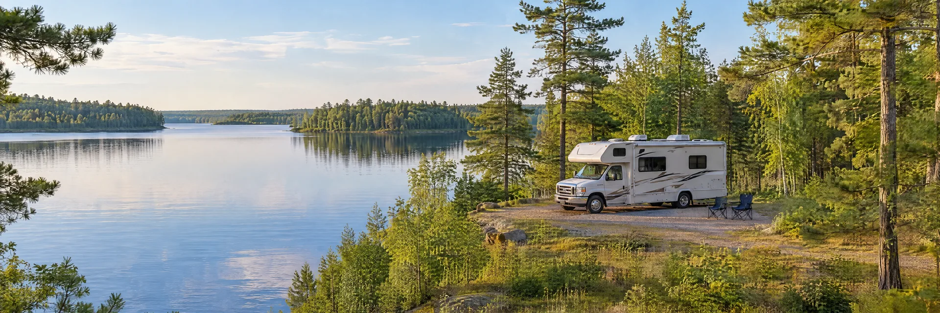 Illustration of a Class C motorhome at a fictional camping setting inspired by Waupaca, WI.