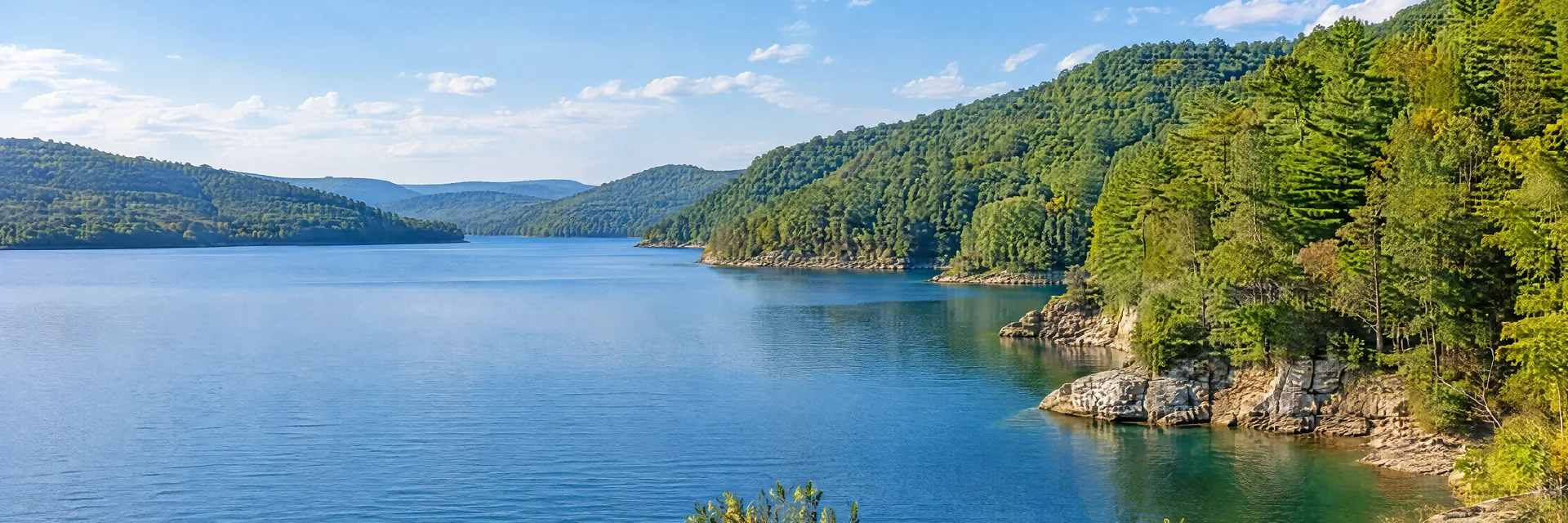 Illustration inspired by Mount Nebo, WV: southern West Virginia Appalachian lake country, clear blue freshwater cove, steep wooded hills and rocky shoreline.