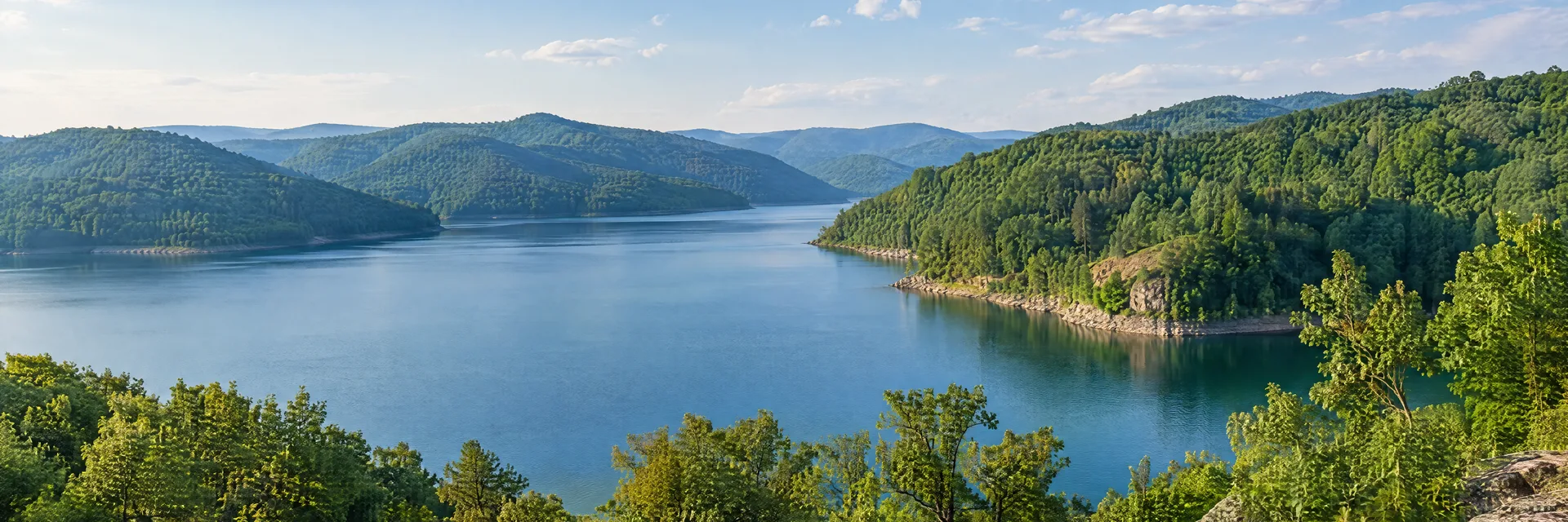Illustration inspired by Sutton, WV: west Virginia forested Appalachian reservoir, green hills and calm blue inlet.
