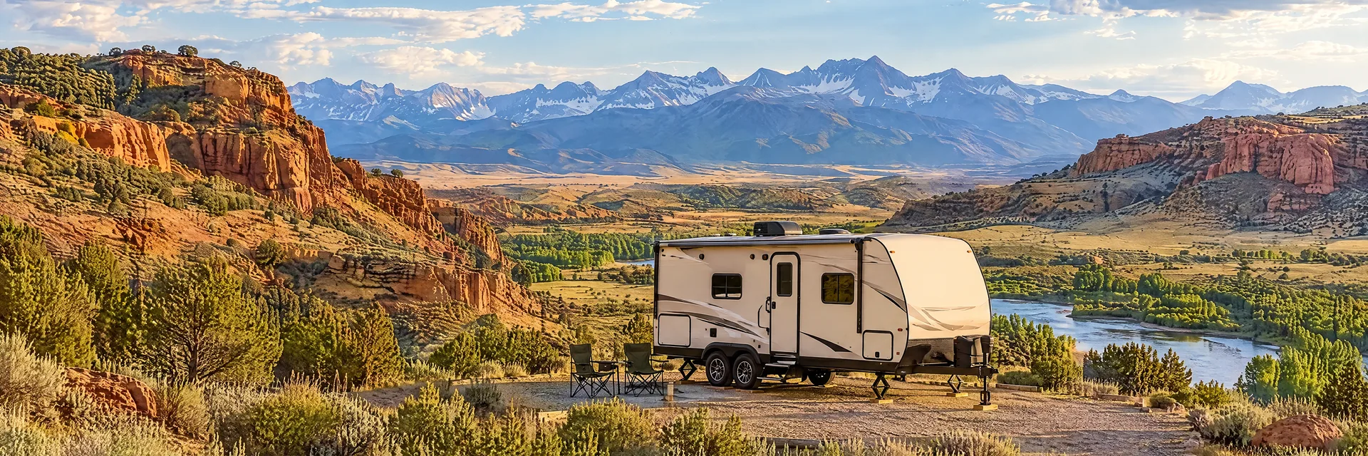 Illustration of a ivory tandem-axle travel trailer with visible hitch and stabilizers at a fictional camping setting inspired by Cody, WY.