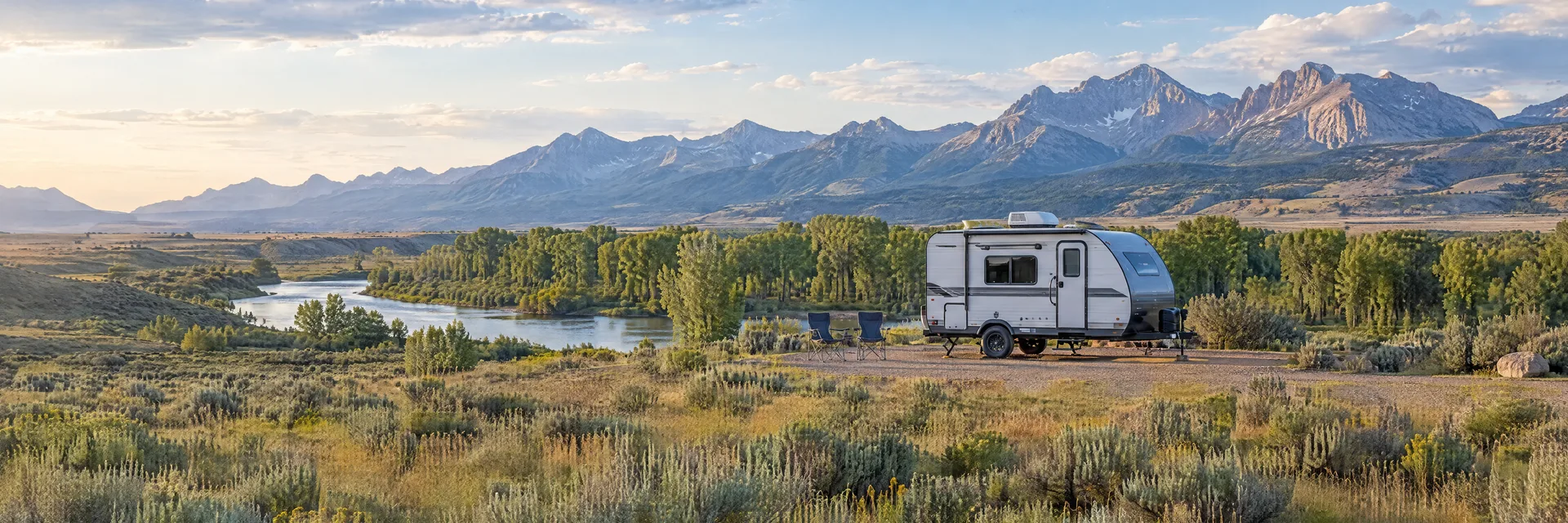 Illustration of a compact travel trailer at a fictional camping setting inspired by Riverton, WY.