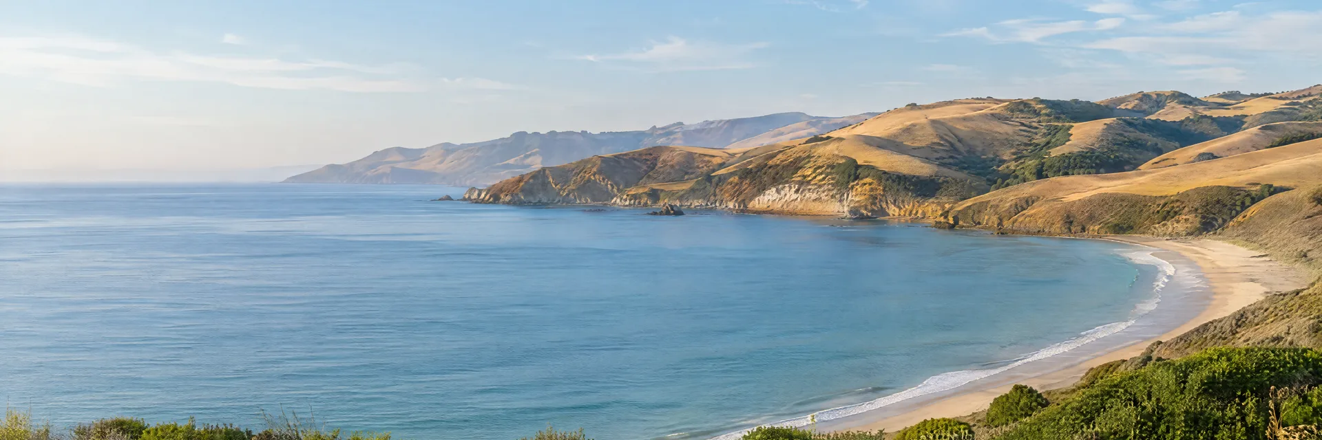 Illustration inspired by Avila Beach, CA: central California sheltered sandy bay, calm Pacific water and softly rolling golden coastal hills.