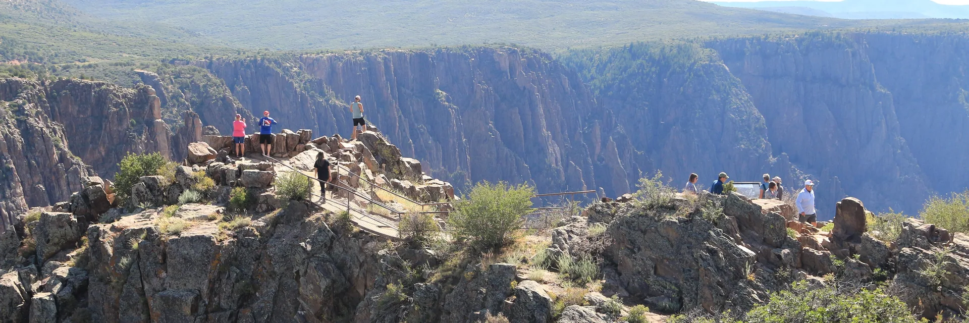 Steep canyon walls and rocky overlooks in Black Canyon of the Gunnison National Park.