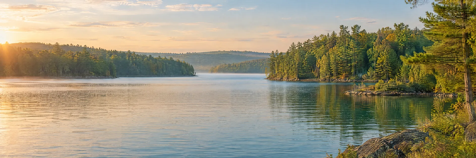 AI-generated illustration inspired by Castle Rock Lake: freshwater reservoir with gently rolling mixed hardwood and pine woodland, irregular coves, blue-green water.