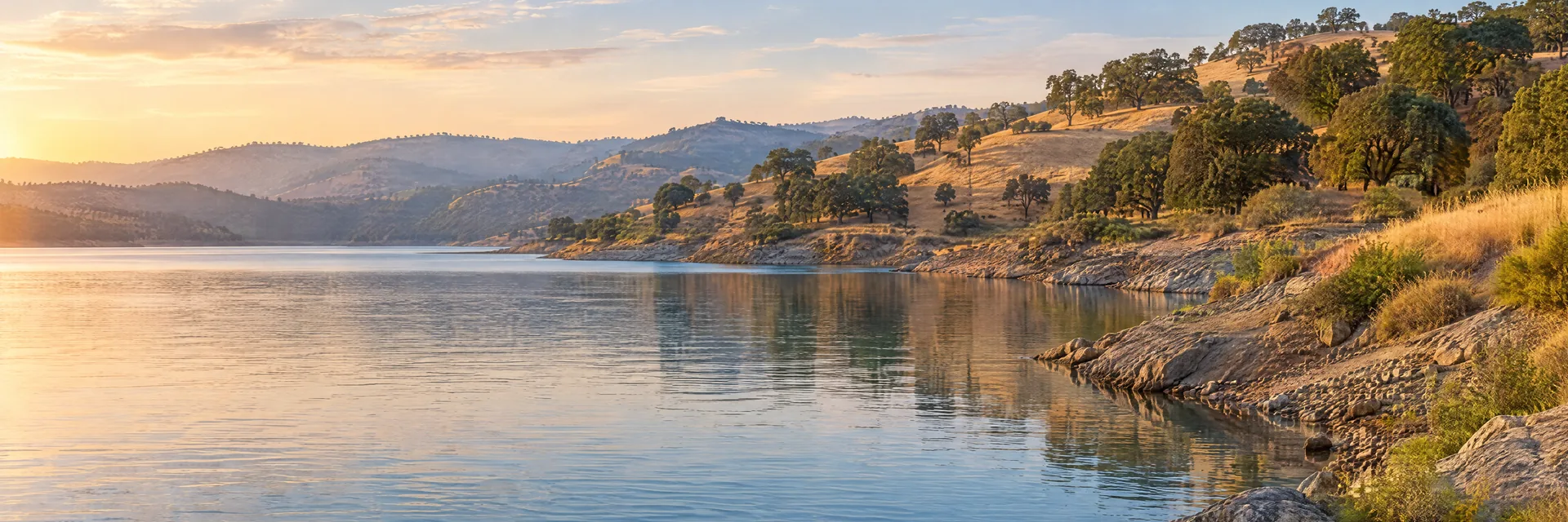 AI-generated illustration inspired by Folsom Lake: California foothill reservoir with oak-dotted golden hills and gently sloping rocky banks.