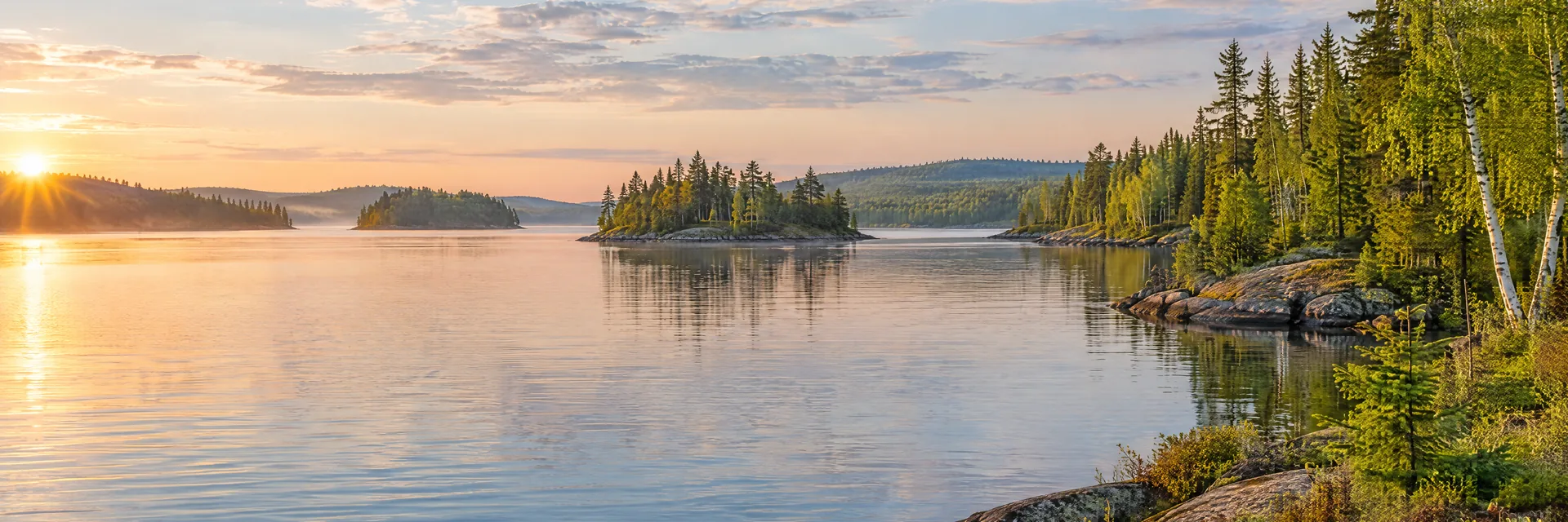 AI-generated illustration inspired by Lac Courte Oreilles: northern freshwater lake, low rocky shoreline with evergreen and birch forest, small wooded islands and gentle rolling terrain.
