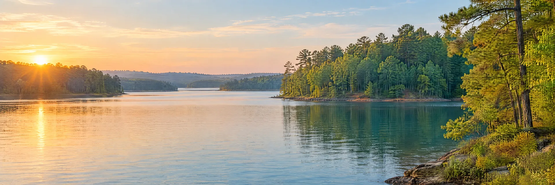 AI-generated illustration inspired by Lake Gaston: freshwater reservoir with gently rolling mixed hardwood and pine woodland, irregular coves, blue-green water.