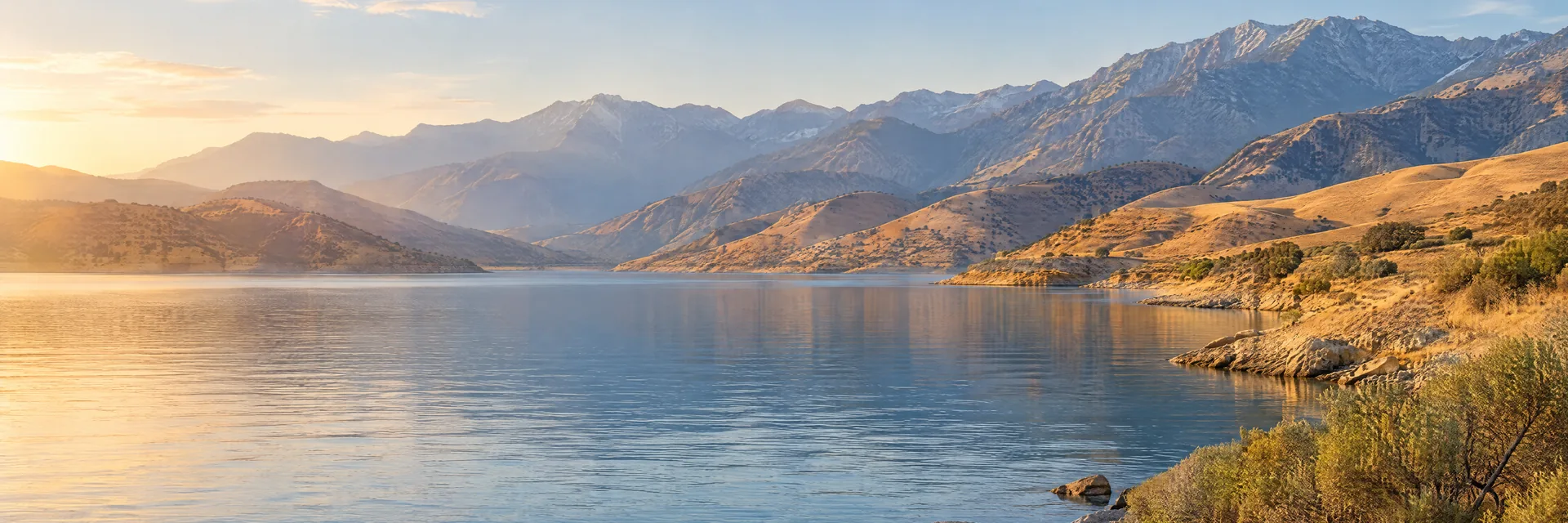 AI-generated illustration inspired by Lake Isabella: California reservoir ringed by dry golden foothills and rugged Sierra uplands.