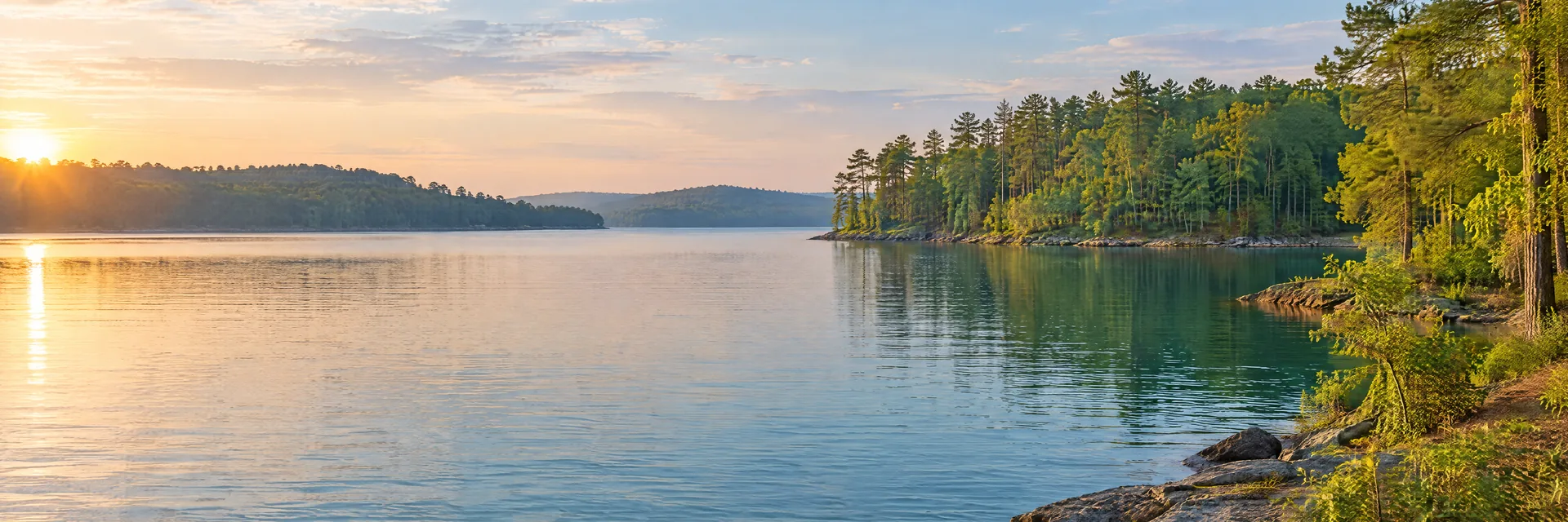 AI-generated illustration inspired by Lake Martin: freshwater reservoir with gently rolling mixed hardwood and pine woodland, irregular coves, blue-green water.