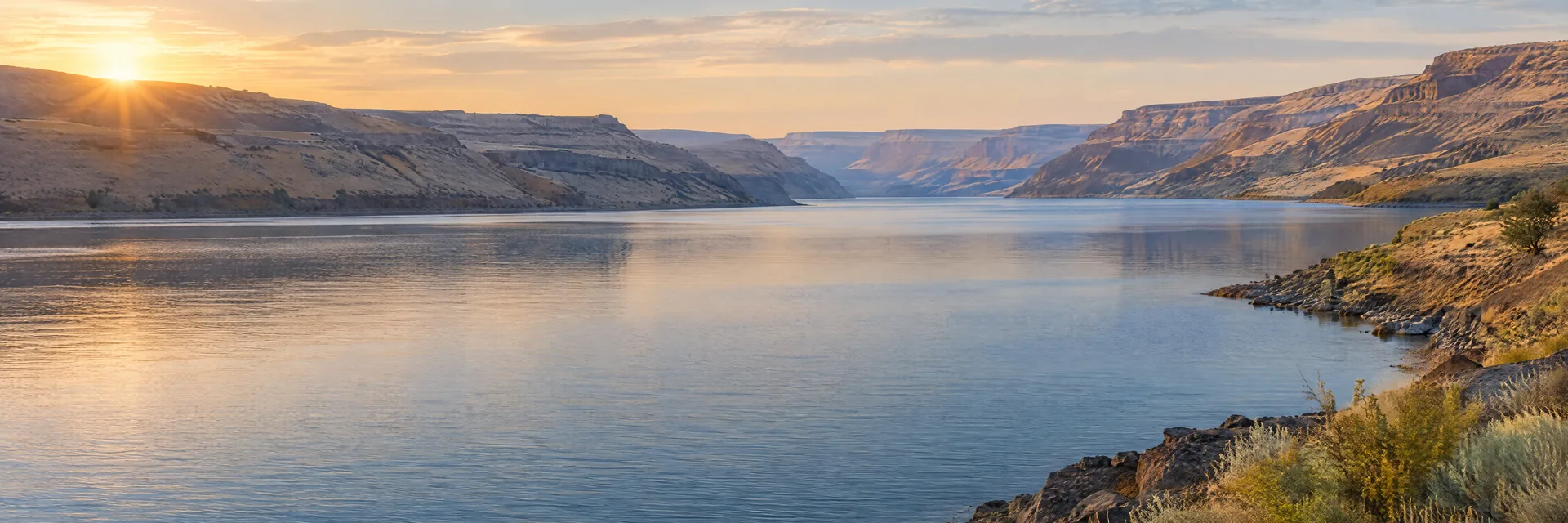 AI-generated illustration inspired by Lake Sacajawea: Snake River reservoir in eastern Washington, dry tan canyon slopes and sparse vegetation.