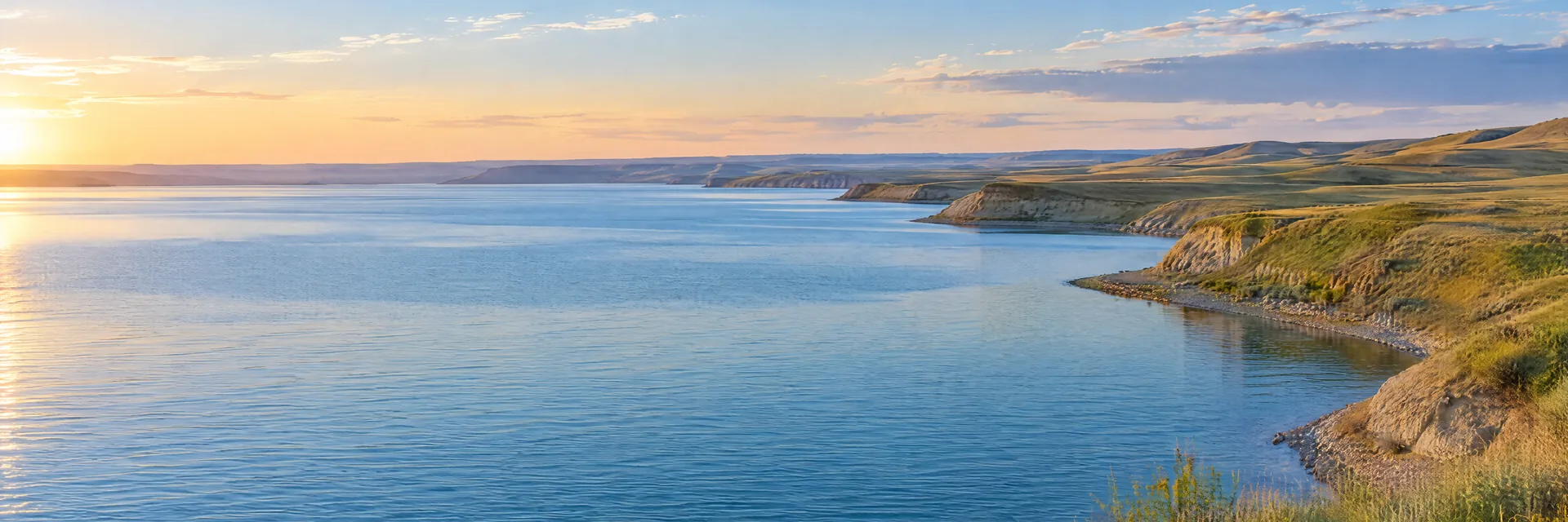 AI-generated illustration inspired by Lake Sakakawea: North Dakota reservoir with long open blue water and treeless rolling prairie bluffs.