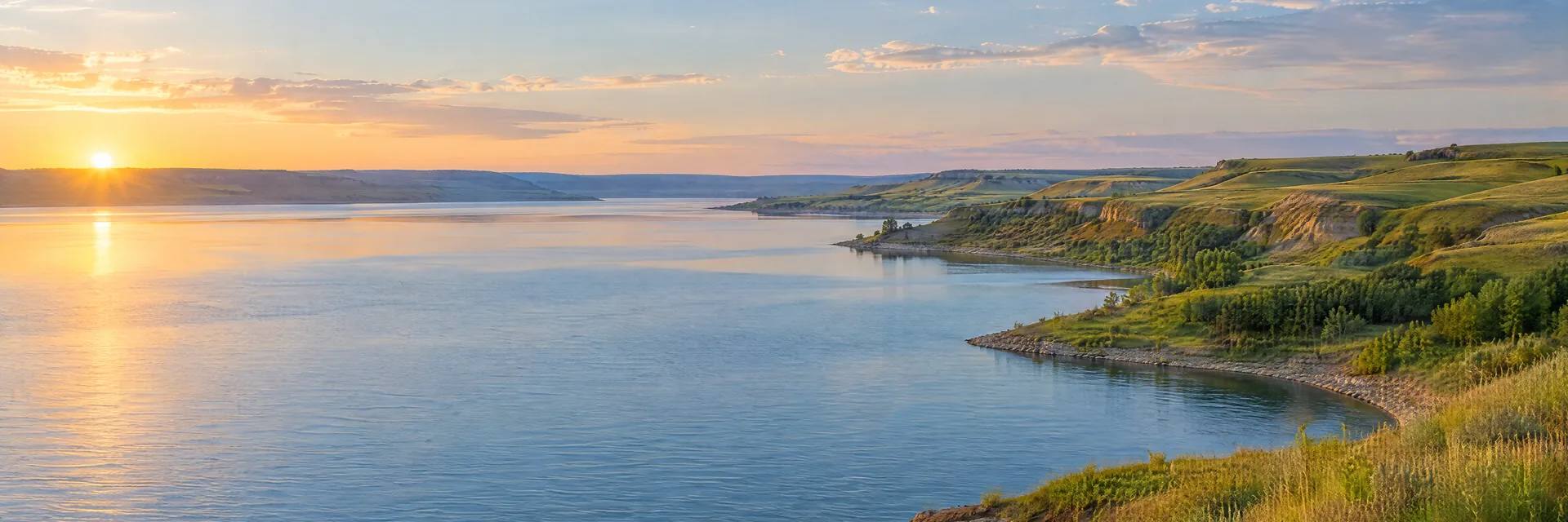 AI-generated illustration inspired by Lewis and Clark Lake: Missouri River reservoir with green rolling prairie bluffs and broad blue water.