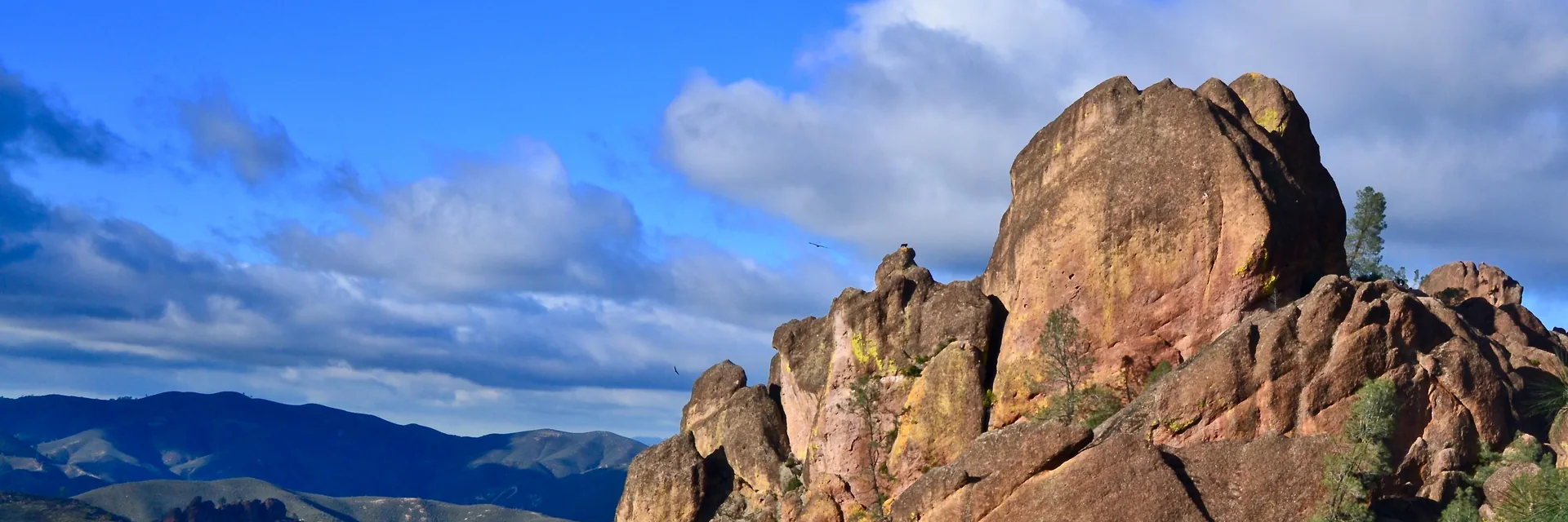A tall rock spire rising above the hills in Pinnacles National Park.