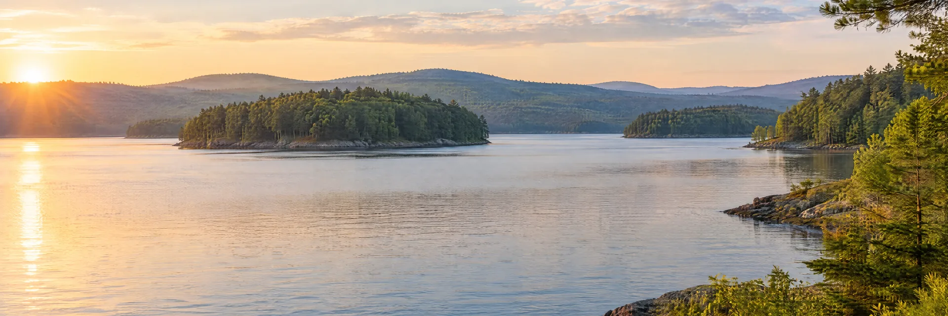 AI-generated illustration inspired by Quabbin Reservoir: Massachusetts wooded reservoir, softly rolling mixed forest hills and islands.