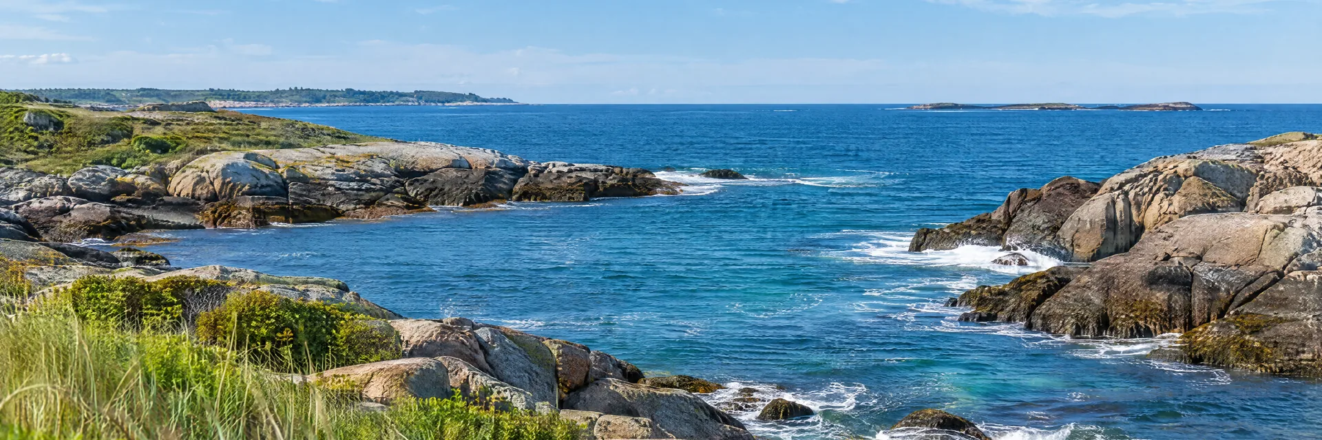 AI-generated illustration inspired by Rhode Island: New England rocky Atlantic shoreline, low granite outcrops, coastal grasses and small waves in a blue ocean cove.